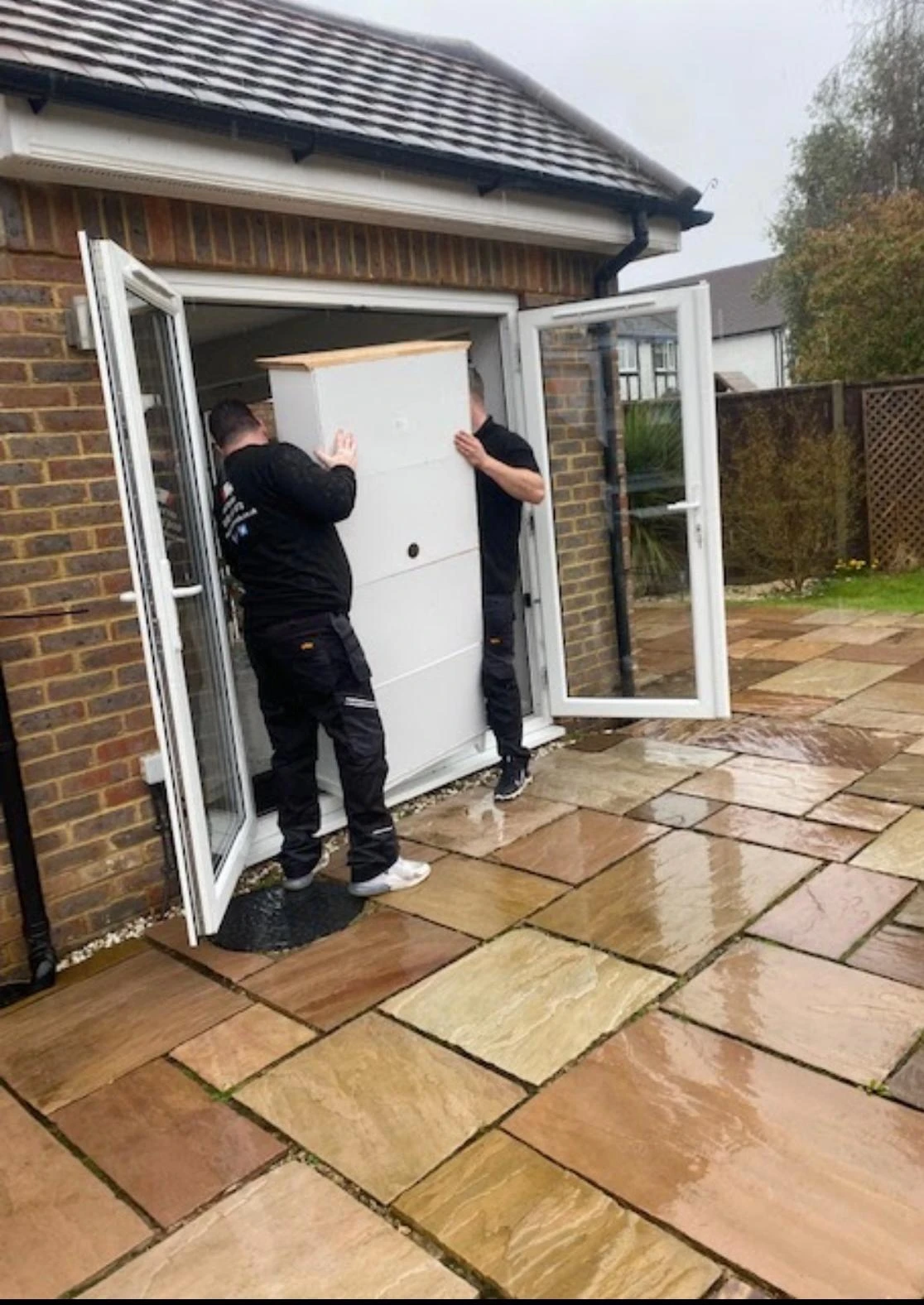 Taking cupboard out the french doors