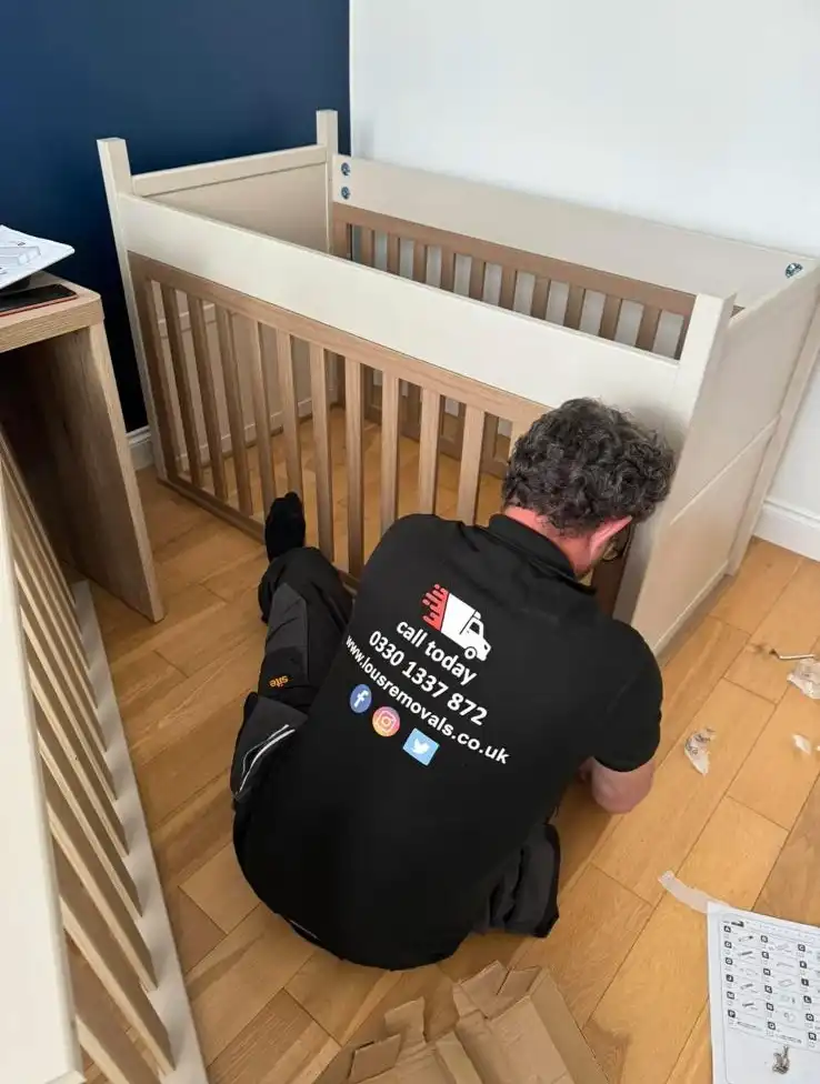 Man reassembling a cot