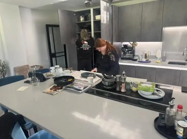 Girls packing up the kitchen.