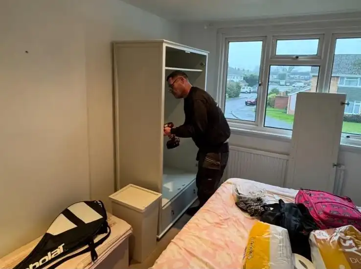 Man building a new bookcase.