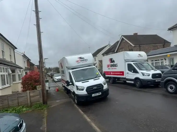2 vans in the road.