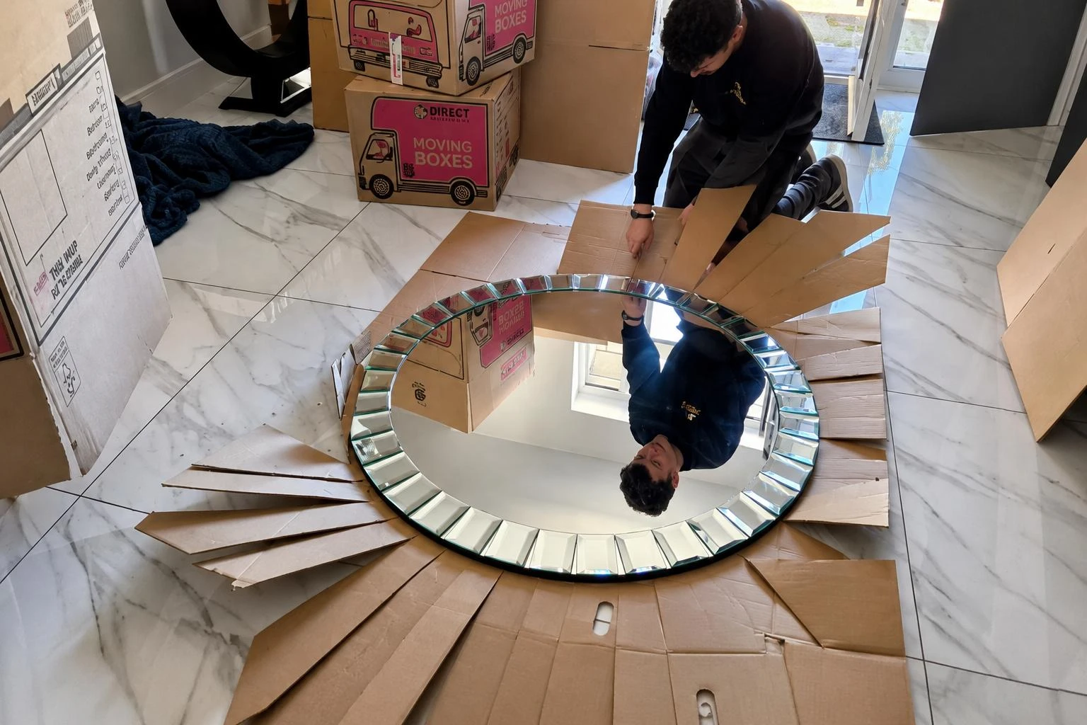 Man packing a mirror.