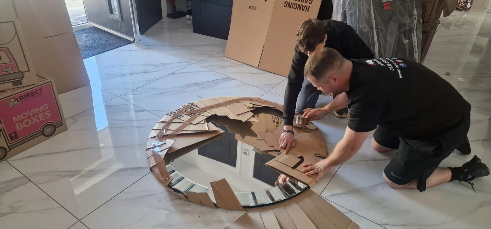 Mirror on the floor being packed.